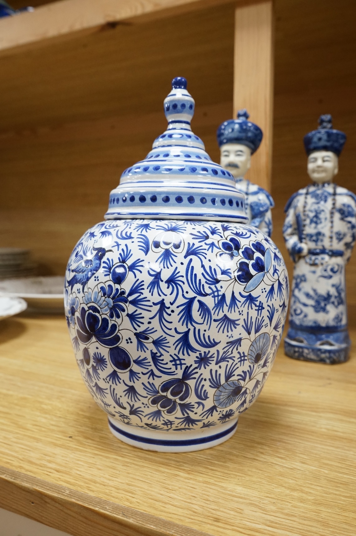 Three Chinese blue and white porcelain figures H 29cm x 9cm., and a Delft tobacco jar H 26cm W 18cm